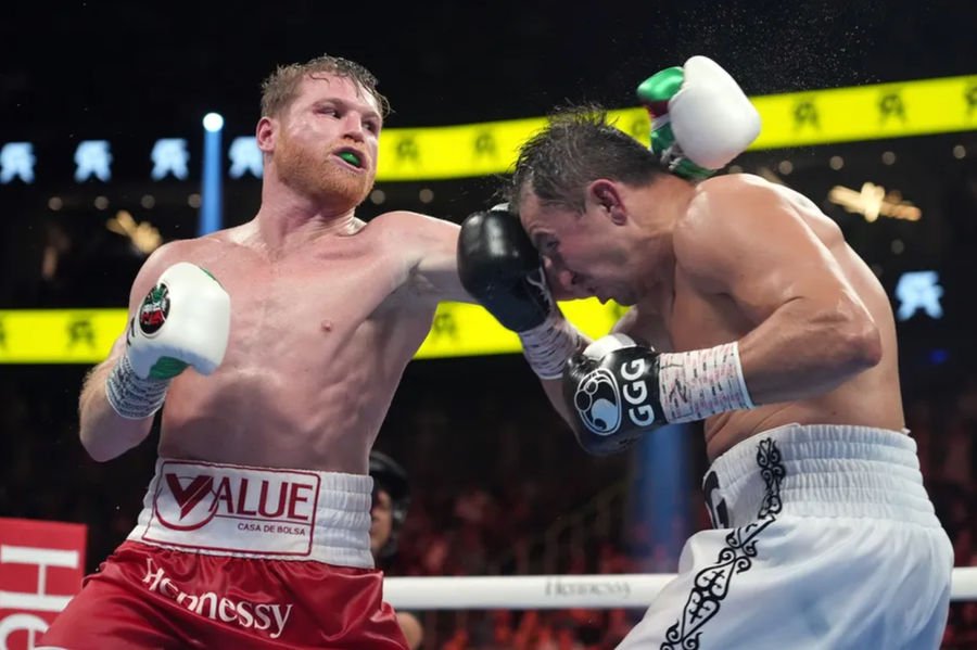 Sep 17, 2022; Las Vegas, Nevada, USA; Canelo Alvarez (red trunks) and Gennadiy Golovkin (white trunks) box during a super middleweight championship bout at T-Mobile Arena. Mandatory Credit: Joe Camporeale-Imagn Images